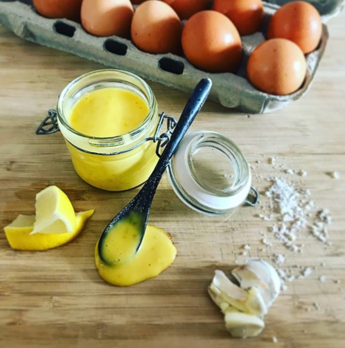 Aioli, eggs, garlic & lemon on chopping board