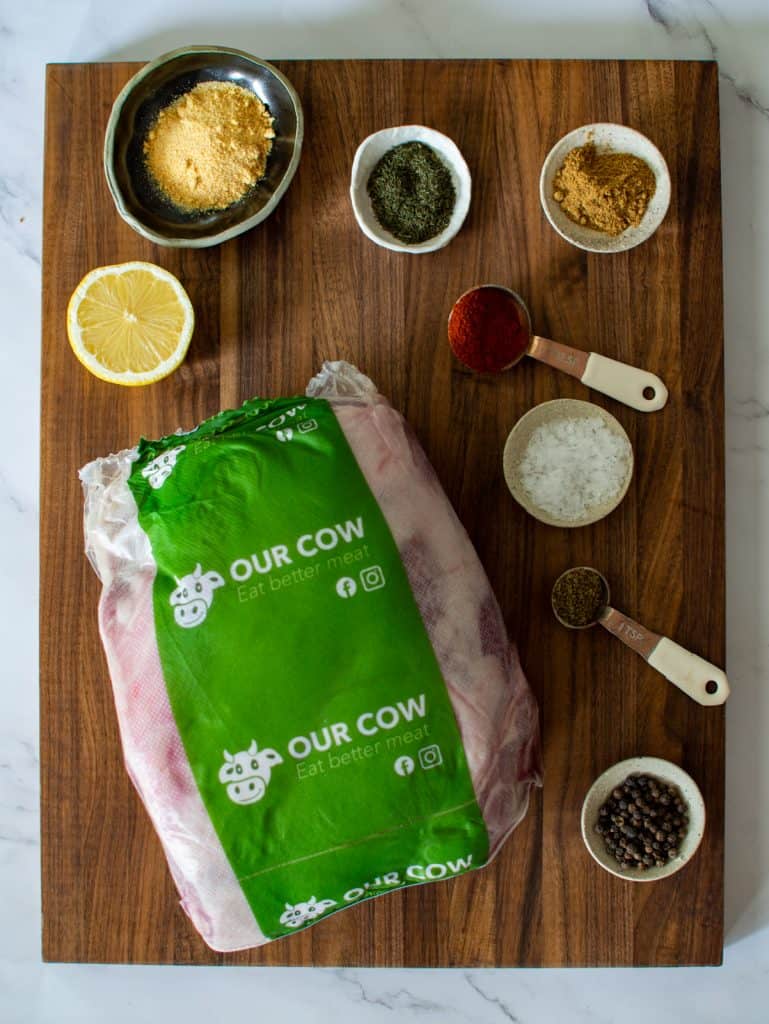 Our cow lamb shoulder and spices on a global chopping board 