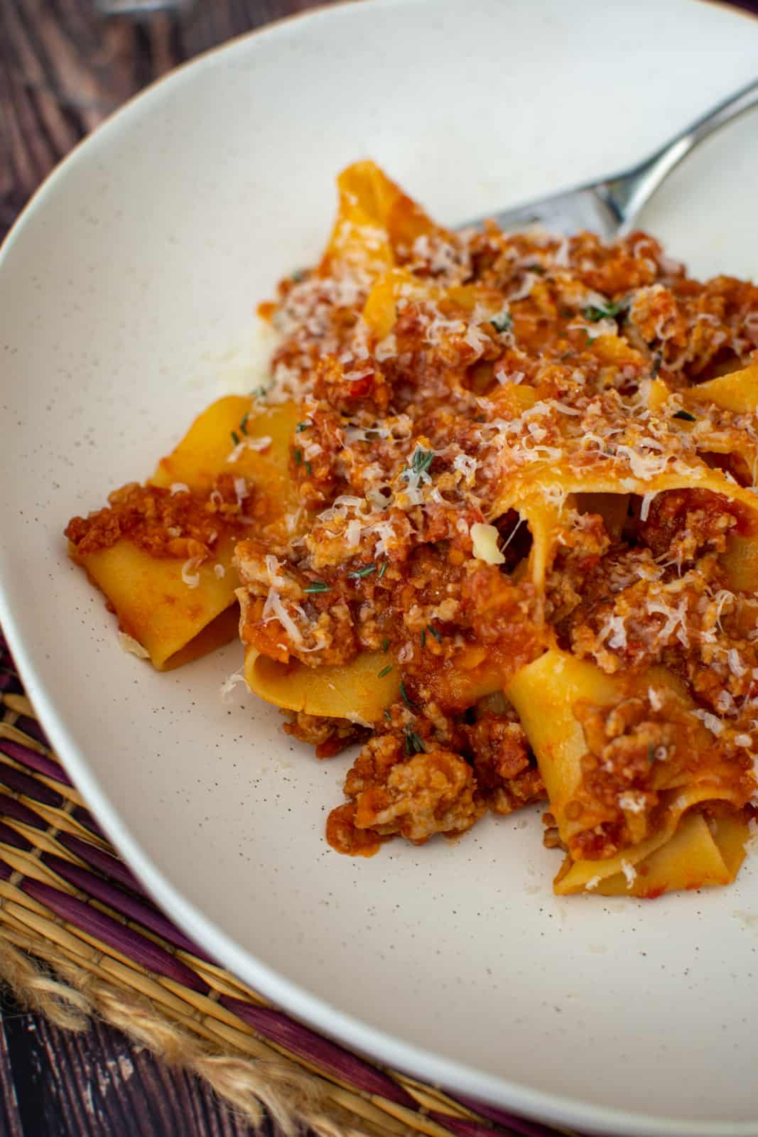 close up of pork chorizo ragu in a white bowl 