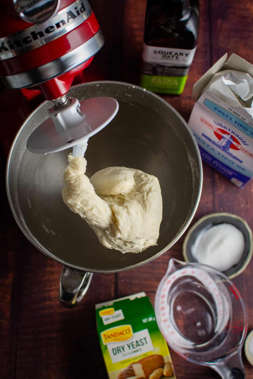 dough hanging from a dough hook in a kitchen aid 